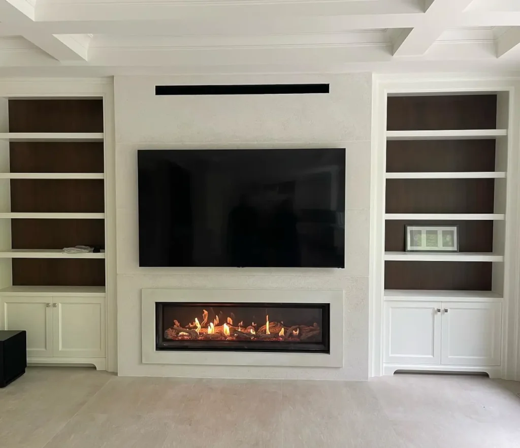 Fancy fireplace with a TV above it