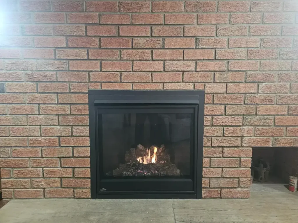 New furnace installation in a brick wall