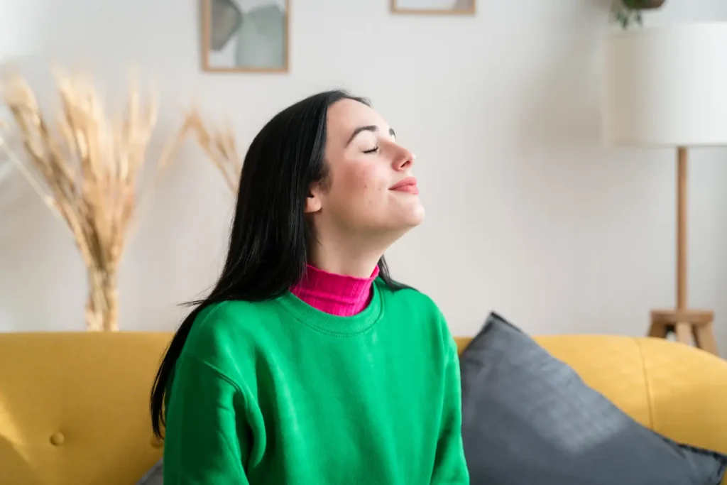 Woman enjoying cool air in her home