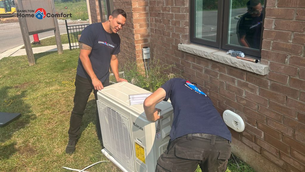Hamilton Home Comfort team installing a heat pump Ontario.